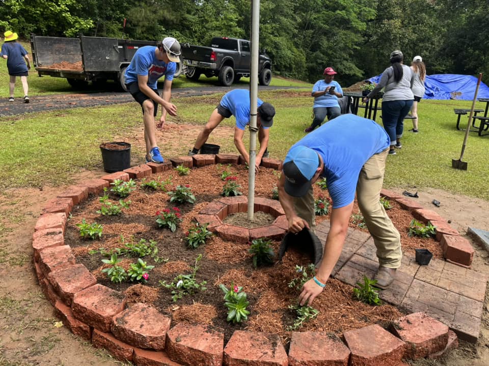 Group of Volunteers Planting Flowers