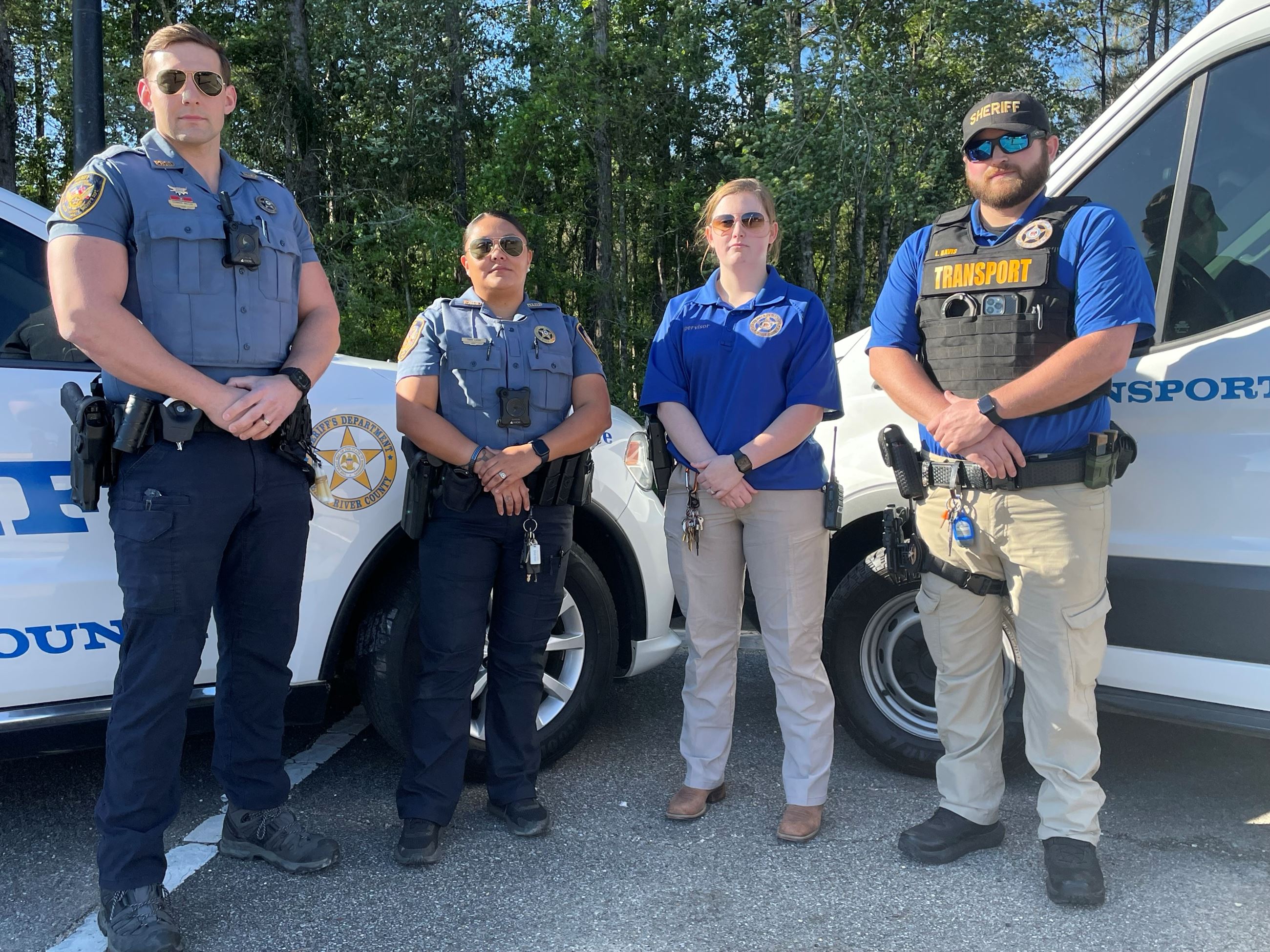 four employees from different divisions of the department